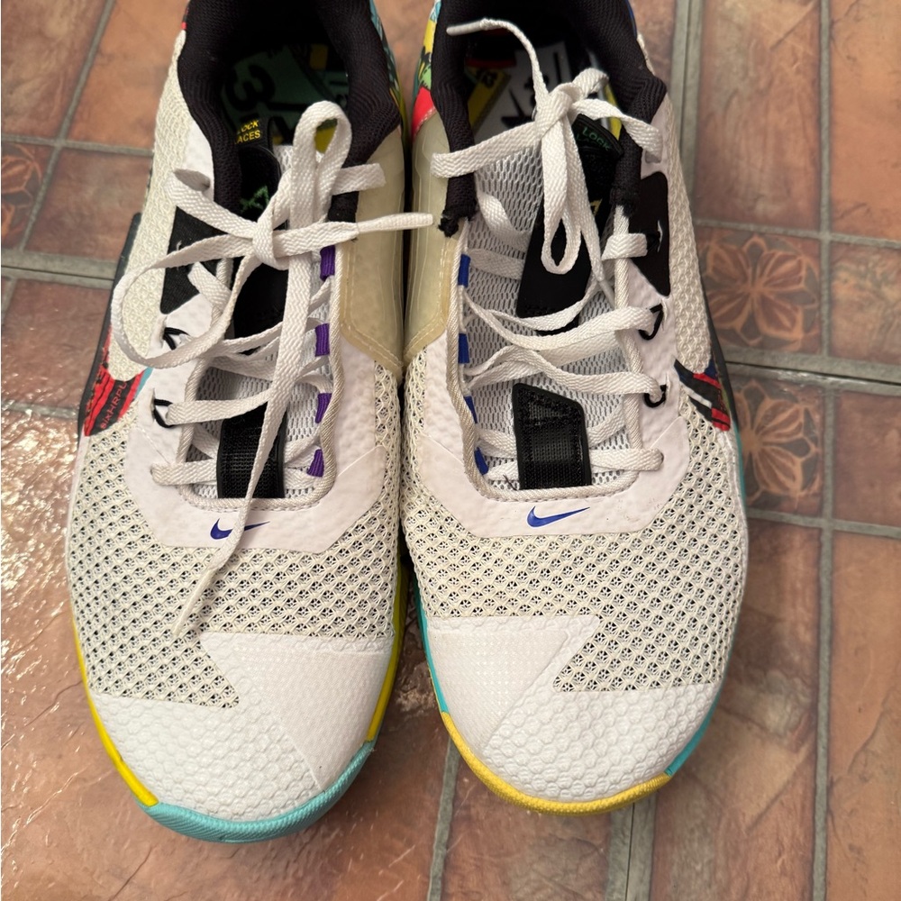 Nike White and Black Athletic Shoes with Yellow Accents